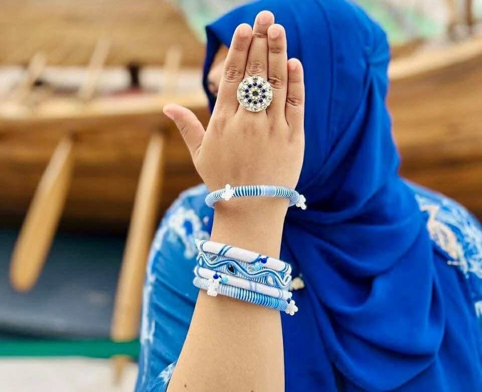 Close view of blue handmade ring and bracelet